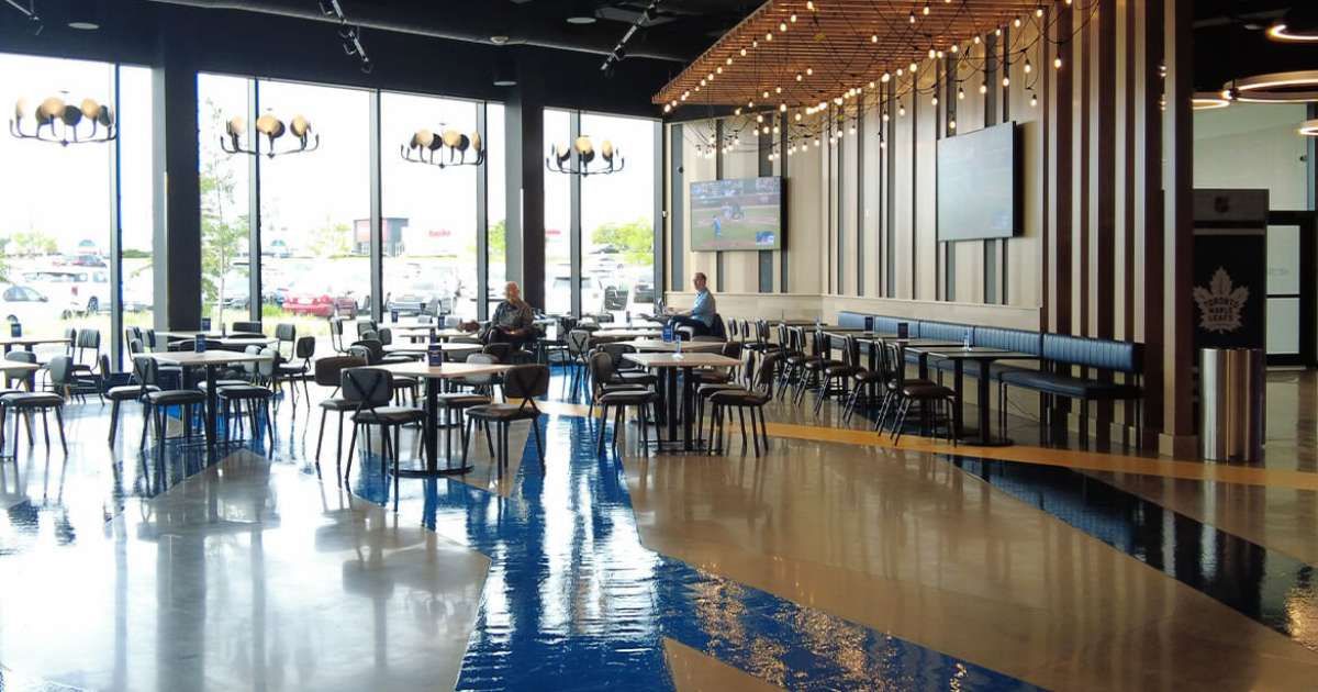 cineplex lobby sitting area with polished concrete floors